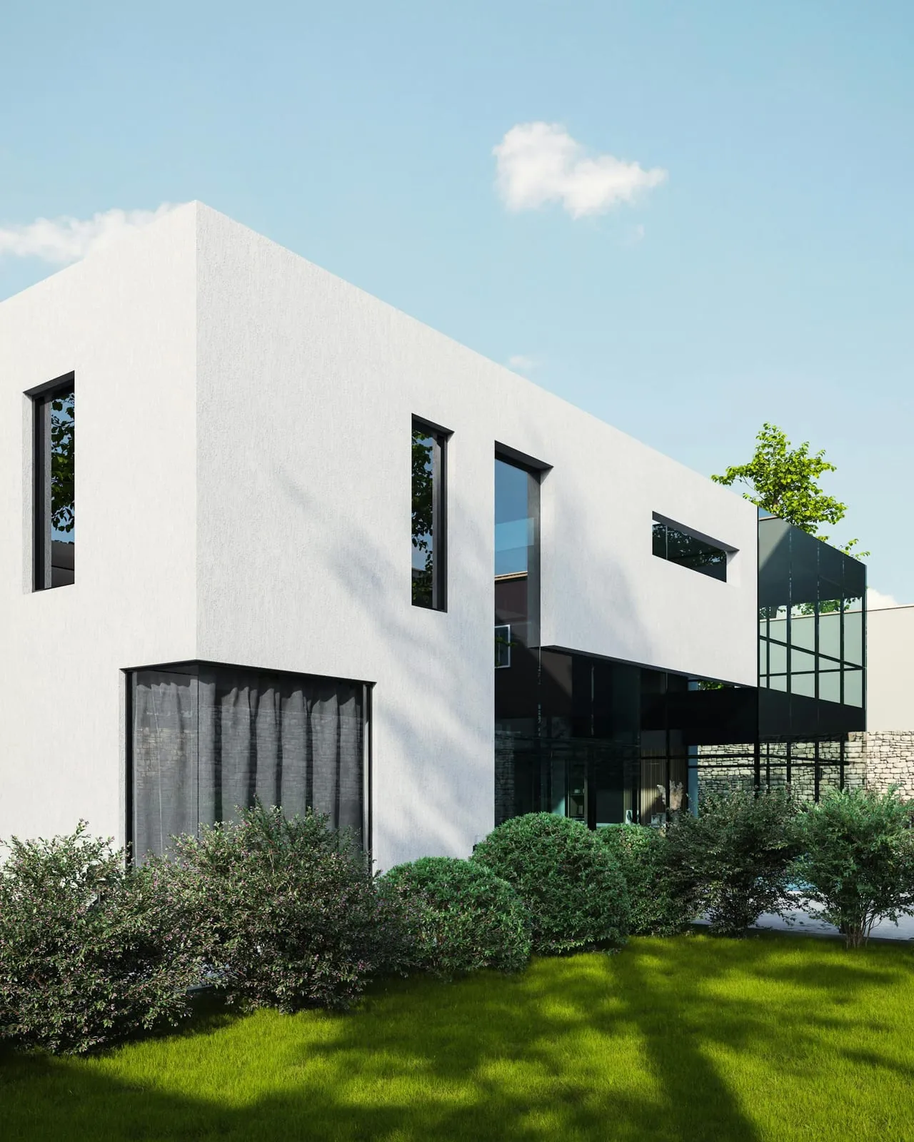 White minimalist house with dark glazing surrounded by green shrubs