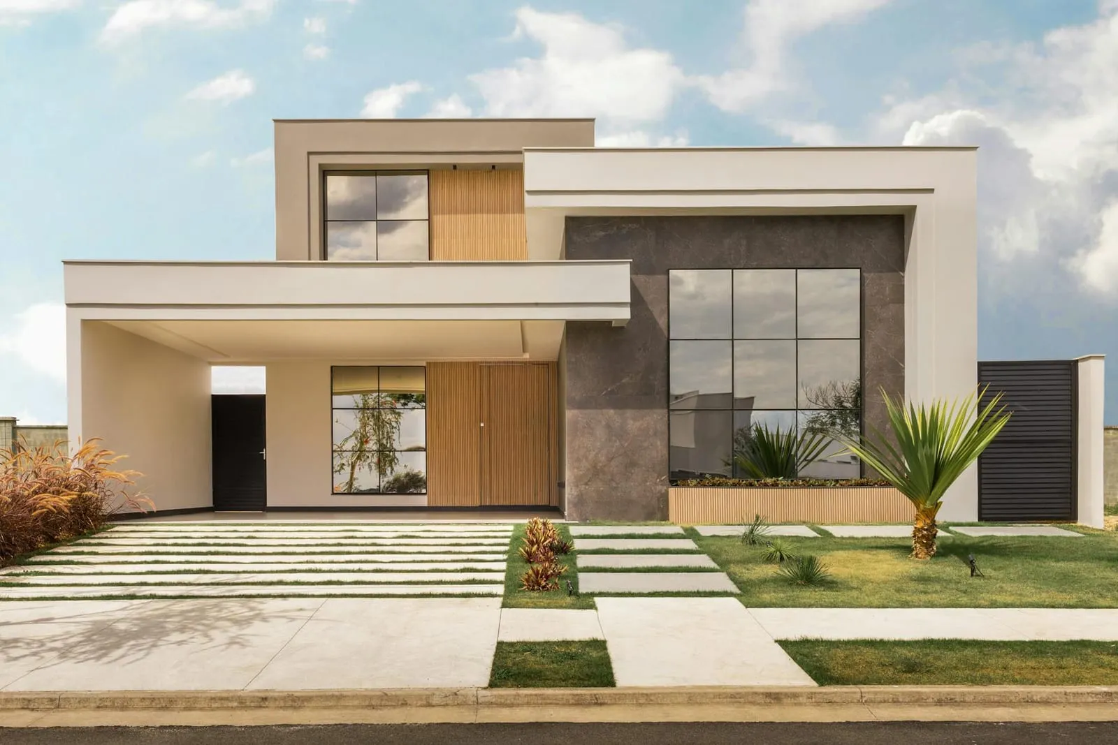 Modern house with wood and stone cladding and a stepped lawn path